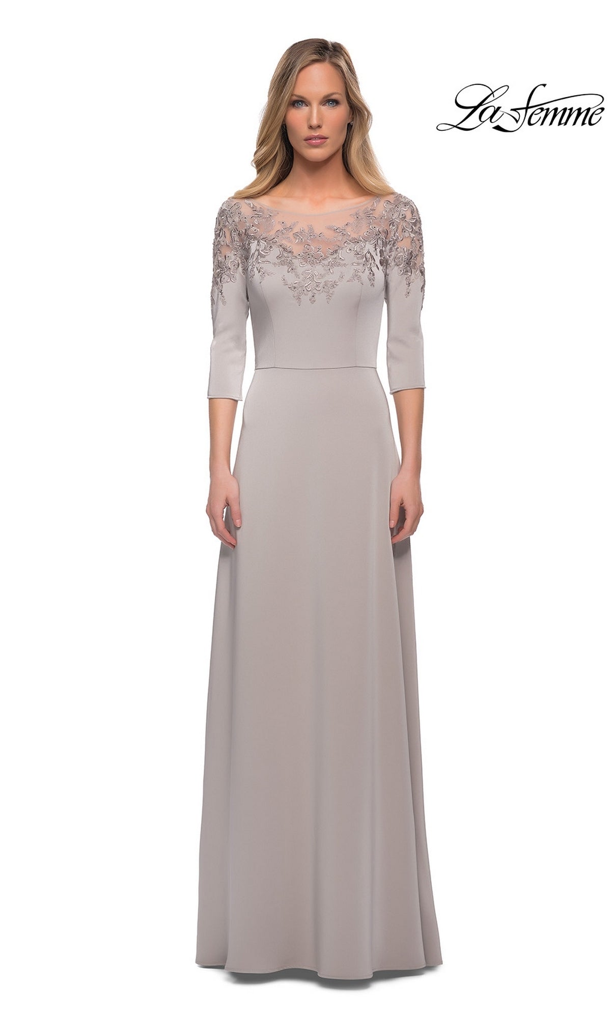 Model wearing Long Formal Dress: La Femme 29227—a modest light gray A-line gown with lace bodice—stands before a white background with the La Femme logo.